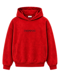A bright red SUEDE pullover hoodie with a black printed text logo reading '[TAXPAYER]' on the chest, displayed against a solid white background.